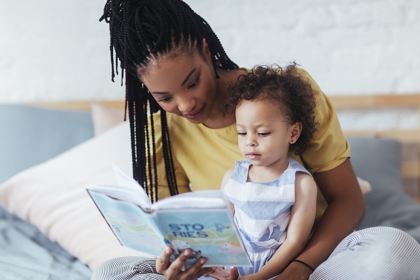 Woman reading to child